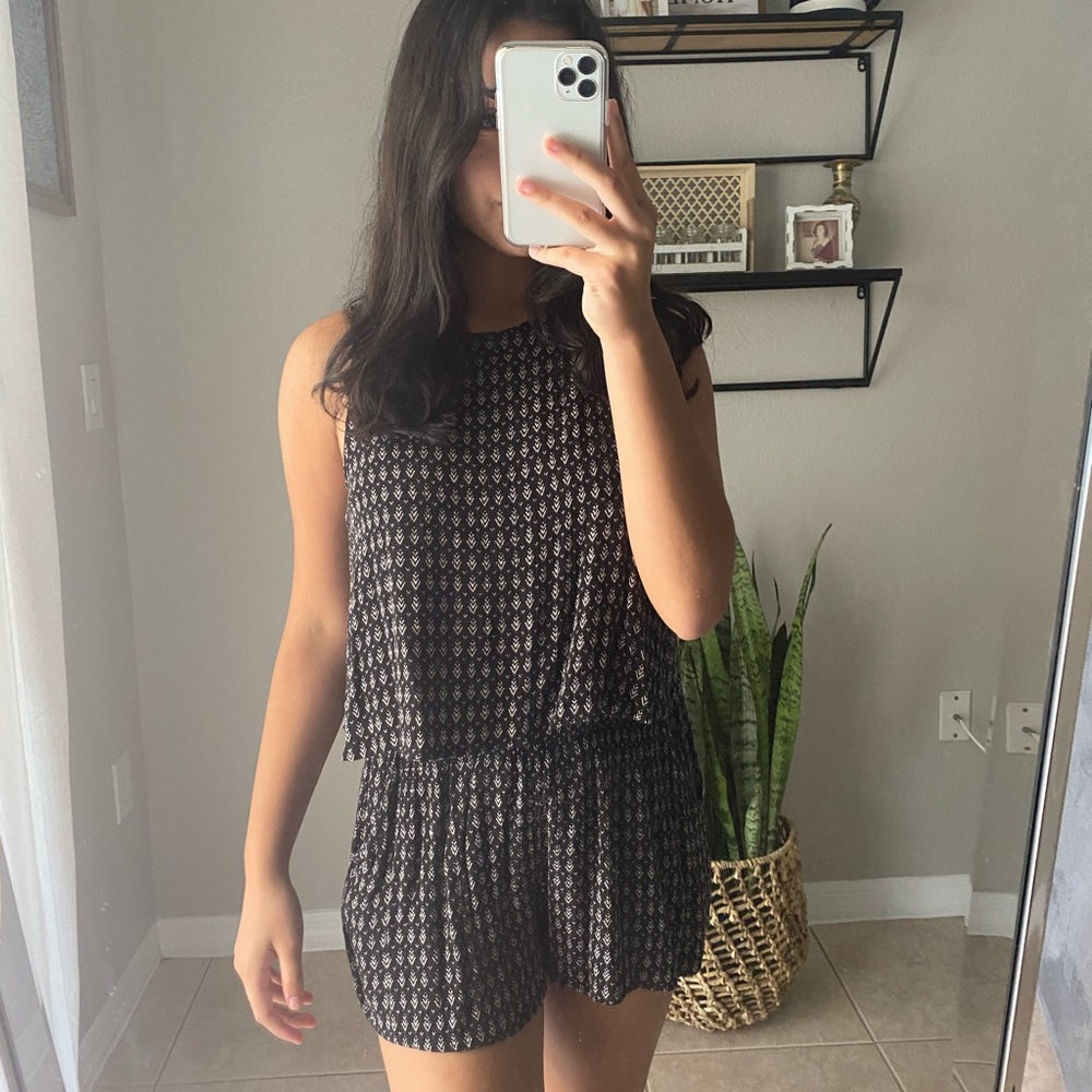 Black romper with white design